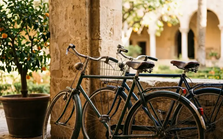 Two bicycles in a courtyard with orange trees (illustrative AI image)