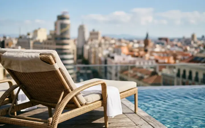 Rooftop pool with a city view (illustrative AI image)
